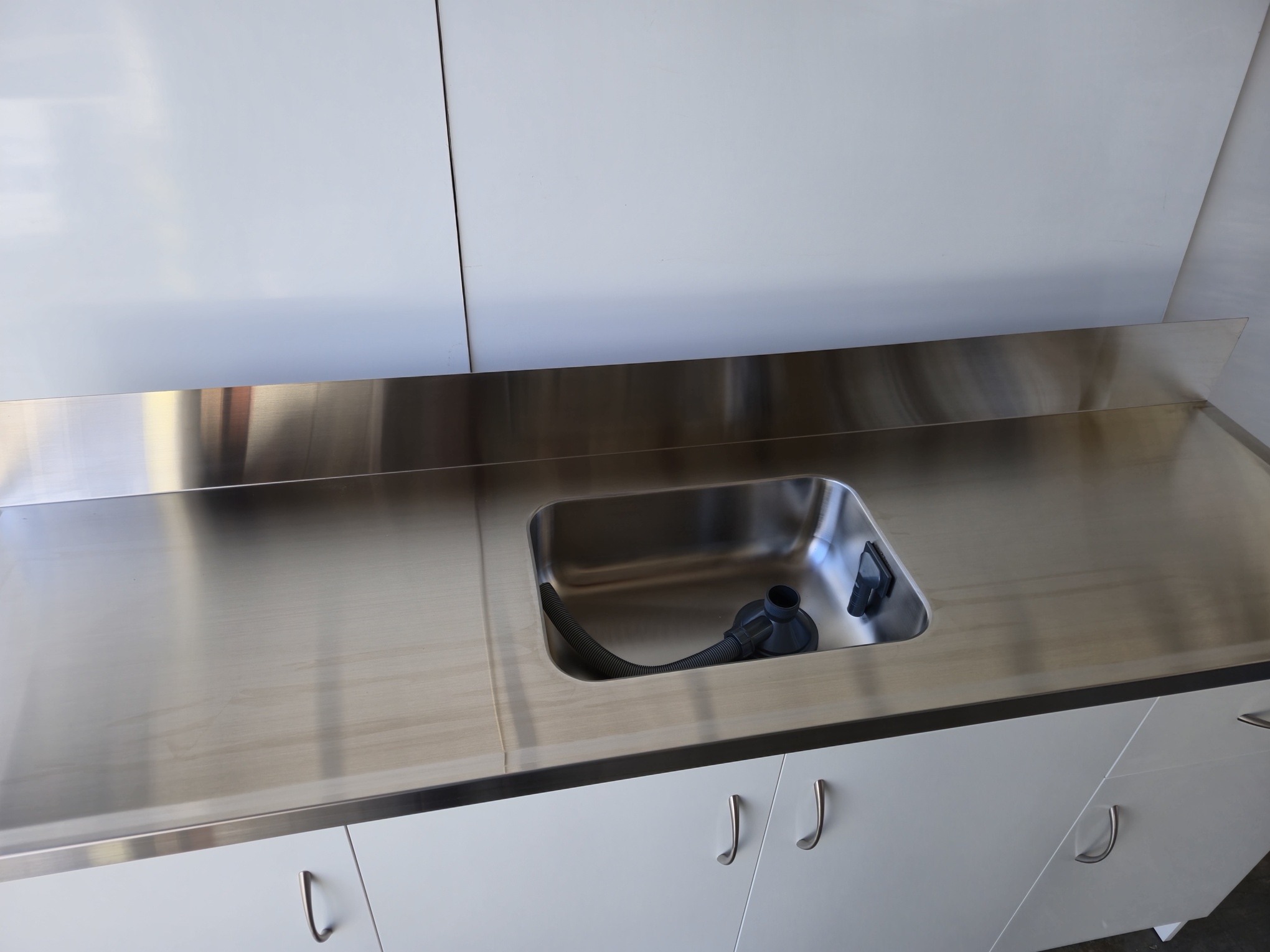 Stainless steel top with upstand
